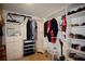 Walk-in closet with shelving units and rods for ample storage at 2540 Ridgehurst Dr, Buford, GA 30518