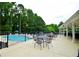 View from the patio of the community pool surrounded by trees, creating a private and relaxing escape at 2540 Ridgehurst Dr, Buford, GA 30518