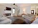 Cozy living room features a fireplace, hardwood floors, neutral walls and a staircase at 2540 Ridgehurst Dr, Buford, GA 30518