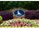 Elegant stone sign for the Windrush community with lush landscaping and colorful flowers at 2540 Ridgehurst Dr, Buford, GA 30518