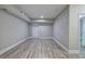 Spacious basement area featuring durable laminate flooring, fresh paint and ample natural light at 2646 Rockcliff Road Se, Atlanta, GA 30316