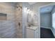 Modern bathroom featuring a tiled walk-in shower, granite countertop, and contemporary lighting at 2646 Rockcliff Road Se, Atlanta, GA 30316
