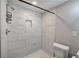 Modern bathroom featuring a tiled walk-in shower and contemporary lighting at 2646 Rockcliff Road Se, Atlanta, GA 30316