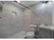 Modern bathroom featuring a tiled walk-in shower and contemporary lighting at 2646 Rockcliff Road Se, Atlanta, GA 30316