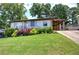 Charming home with well-kept lawn, pretty plants, and a convenient carport at 2646 Rockcliff Road Se, Atlanta, GA 30316