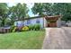 Quaint home features a covered carport and beautiful landscaping at 2646 Rockcliff Road Se, Atlanta, GA 30316