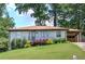 Single-story home with fresh landscaping and a convenient covered carport at 2646 Rockcliff Road Se, Atlanta, GA 30316