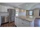 Bright kitchen featuring stainless steel appliances, white cabinets, and a granite-topped island at 2646 Rockcliff Road Se, Atlanta, GA 30316