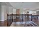Open concept view highlighting the kitchen with stainless appliances and the staircase with ornate railing at 2646 Rockcliff Road Se, Atlanta, GA 30316
