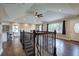 Open-concept living room with hardwood floors, large windows, and decorative staircase at 2646 Rockcliff Road Se, Atlanta, GA 30316