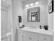 Bathroom featuring white cabinets, a mirror and a small decor for a simple, yet elegant design at 5515 Pennybrook Trl, Stone Mountain, GA 30087