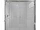 Bathroom with a tile shower with a glass door, providing a clean and luxurious experience at 5515 Pennybrook Trl, Stone Mountain, GA 30087