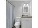 Cozy bathroom with a tiled shower and vanity with granite countertops at 5515 Pennybrook Trl, Stone Mountain, GA 30087