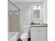 Neutral bathroom with a tiled shower and vanity with granite countertops at 5515 Pennybrook Trl, Stone Mountain, GA 30087