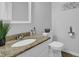 Bathroom featuring granite countertop, oval sink, and neutral wall color at 5515 Pennybrook Trl, Stone Mountain, GA 30087