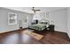Well lit bedroom with an accent rug and decorative prints at 5515 Pennybrook Trl, Stone Mountain, GA 30087