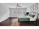 Spacious bedroom with wood floors, and ample sunlight at 5515 Pennybrook Trl, Stone Mountain, GA 30087