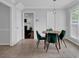 Bright dining room with views into the living room and hallway, tiled floor and natural light at 5515 Pennybrook Trl, Stone Mountain, GA 30087