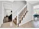 Foyer with carpeted stairs, tile flooring, and views into the living and dining spaces at 5515 Pennybrook Trl, Stone Mountain, GA 30087