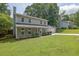 Two-story home with a well-manicured lawn, inviting front porch, and attached two-car garage at 5515 Pennybrook Trl, Stone Mountain, GA 30087