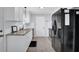 Kitchen featuring stainless steel appliances, granite countertops, and white cabinets, creating a modern cooking space at 5515 Pennybrook Trl, Stone Mountain, GA 30087