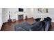 Comfortable living room with a fireplace, hardwood floors, and stylish decor at 5515 Pennybrook Trl, Stone Mountain, GA 30087
