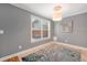 This room has a lot of light and is decorated with a modern chandelier at 764 Patterns Sw Dr, Mableton, GA 30126