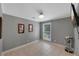 Well-lit bedroom with neutral walls, tiled floors, and ample space for furniture at 764 Patterns Sw Dr, Mableton, GA 30126