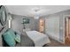 Bedroom is well-lit and decorated with comfortable bed and a dresser at 764 Patterns Sw Dr, Mableton, GA 30126