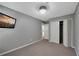 Neutral bedroom features a closet with double doors for ample storage and wall-mounted TV at 764 Patterns Sw Dr, Mableton, GA 30126