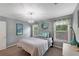 Bedroom featuring stylish chandelier, comfortable bed, and natural lighting at 764 Patterns Sw Dr, Mableton, GA 30126