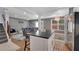 Open kitchen with island seating, hardwood floors, and flows into the living and dining area at 764 Patterns Sw Dr, Mableton, GA 30126