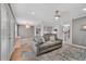 Bright living room with hardwood floors, open to kitchen with stainless appliances and dining area at 764 Patterns Sw Dr, Mableton, GA 30126