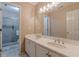 Bathroom features a double vanity and a tiled shower with glass door at 1101 Parkland Se Run, Smyrna, GA 30082