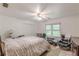Bright bedroom with a ceiling fan, chair, and side tables at 1101 Parkland Se Run, Smyrna, GA 30082