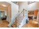 Inviting foyer with hardwood floors, staircase, and views into living and dining areas at 1101 Parkland Se Run, Smyrna, GA 30082