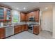 Well-lit kitchen features stainless steel appliances and handsome wood cabinets at 1101 Parkland Se Run, Smyrna, GA 30082