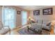 Cozy living room featuring large windows, hardwood floors, and elegant furnishings at 1101 Parkland Se Run, Smyrna, GA 30082