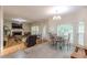 Open concept living room with fireplace, tile flooring, and views of eat-in kitchen at 1101 Parkland Se Run, Smyrna, GA 30082