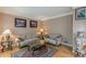 Comfortable living room with hardwood floors, neutral decor, and stylish furnishings at 1101 Parkland Se Run, Smyrna, GA 30082