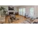 Spacious living room featuring a fireplace, hardwood floors, and natural light at 1101 Parkland Se Run, Smyrna, GA 30082