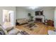 Inviting living room with fireplace, hardwood floors, and a comfortable seating arrangement at 1101 Parkland Se Run, Smyrna, GA 30082