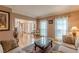 Bright living room with hardwood floors, large windows, and open floor plan at 1101 Parkland Se Run, Smyrna, GA 30082