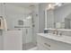 Modern bathroom features a tiled shower with glass door, a granite countertop vanity, and updated fixtures at 1324 Concord Sw Cir, Lilburn, GA 30047
