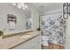 Bathroom featuring granite counters, floral shower curtain, and wood look floors at 1324 Concord Sw Cir, Lilburn, GA 30047