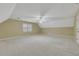 Spacious bonus room with neutral carpet, pitched ceiling, and abundant natural light at 1324 Concord Sw Cir, Lilburn, GA 30047