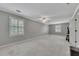 Expansive bonus room with neutral carpet and ample natural light at 1324 Concord Sw Cir, Lilburn, GA 30047