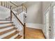 Inviting foyer with hardwood floors, staircase, and decorative trim leading to the upper level at 1324 Concord Sw Cir, Lilburn, GA 30047