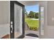 Elegant front door with decorative glass panels offering a glimpse of the well-kept lawn at 1324 Concord Sw Cir, Lilburn, GA 30047