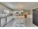 Bright kitchen with island, white cabinets, stainless appliances, and an open layout perfect for entertaining at 1324 Concord Sw Cir, Lilburn, GA 30047